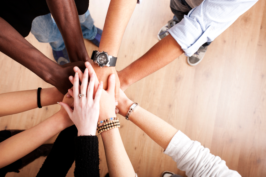 Teamwork_Coworkers_Hands_Huddle_iStock_000014186302Small